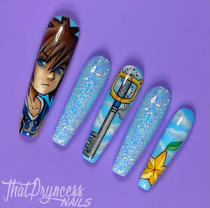 image of 5 long coffin nails. one has the image of sora from kingdom hearts painted on it. another has the keyblade painted on it. and another has the yellow star paopu fruit. two nails have baby blue encapsulated glitter.